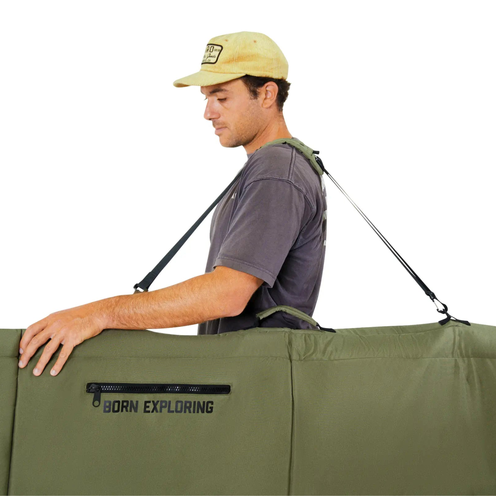 Man wearing a cap and carrying a large green backpack with 'Born Exploring' branding on a white background