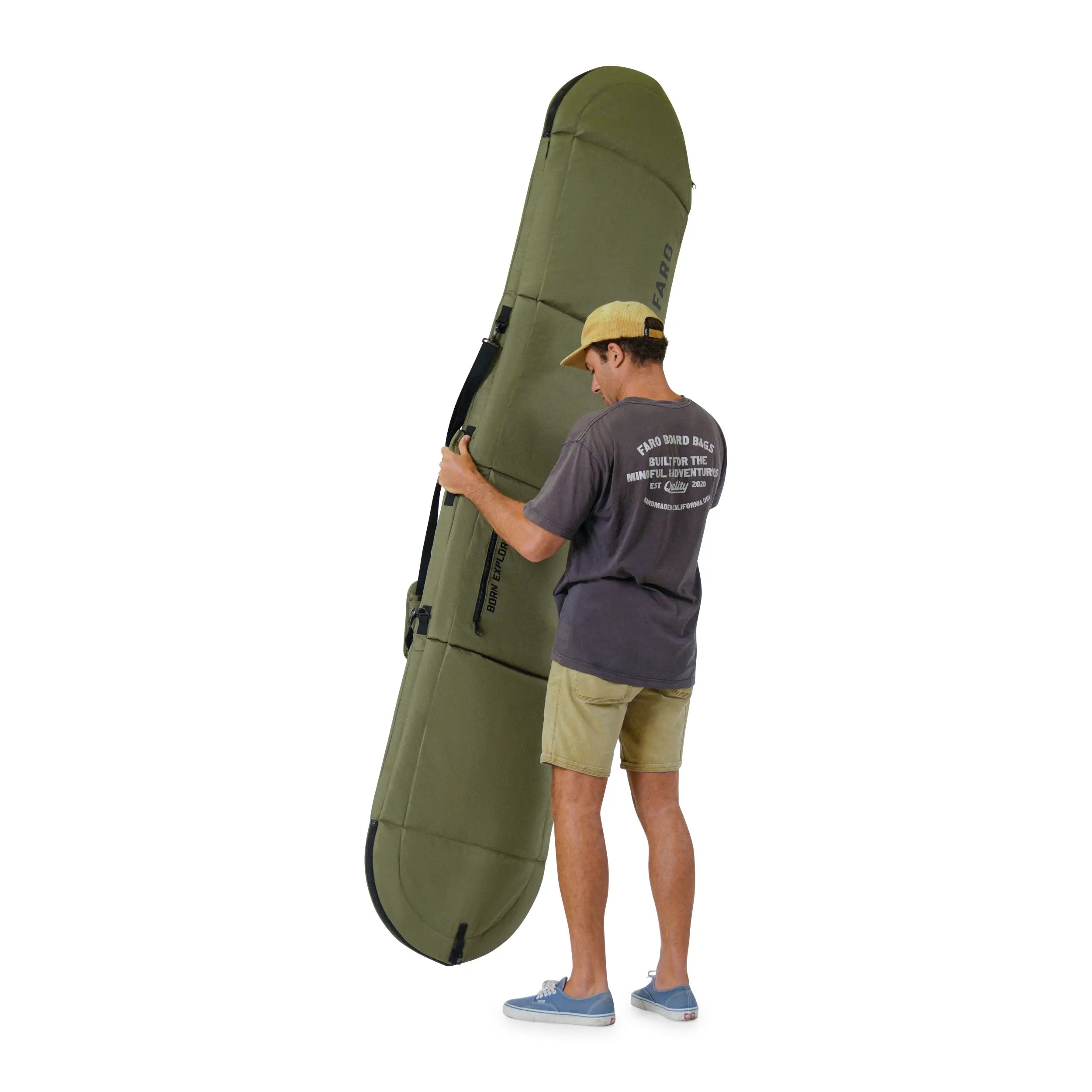 Person holding a surfboard in a bag
