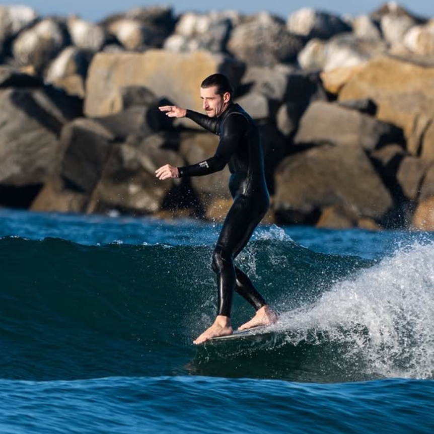 Connor on a wave surfing - FARO BOARD BAG rider