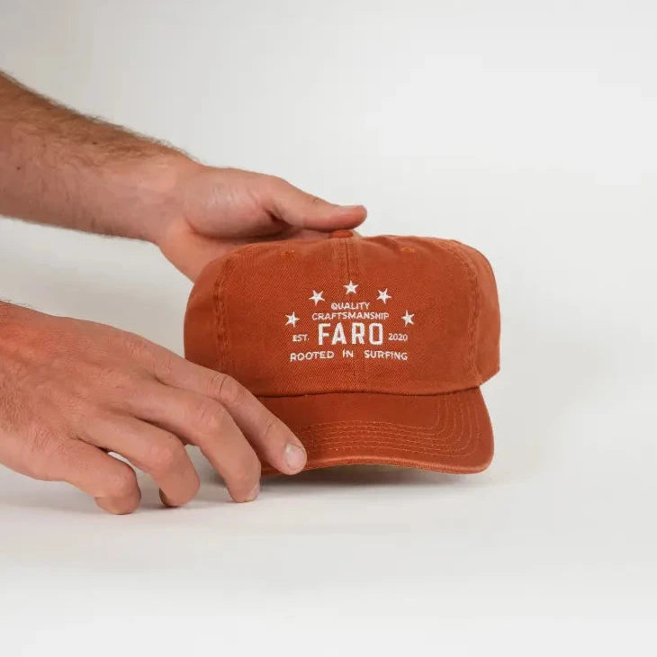 Faro hat being held by a person