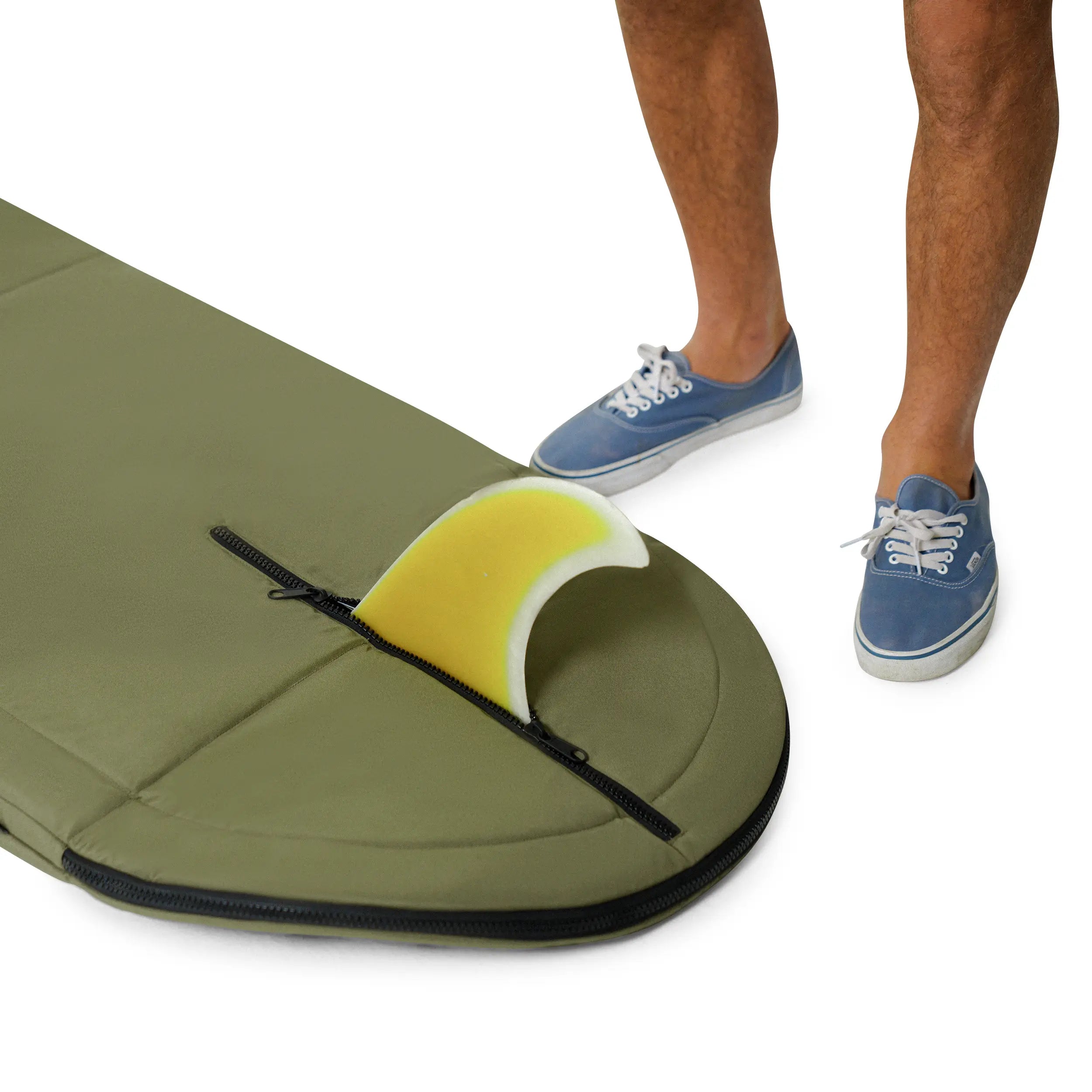 Green and yellow surfboard with a person wearing blue sneakers on a white background