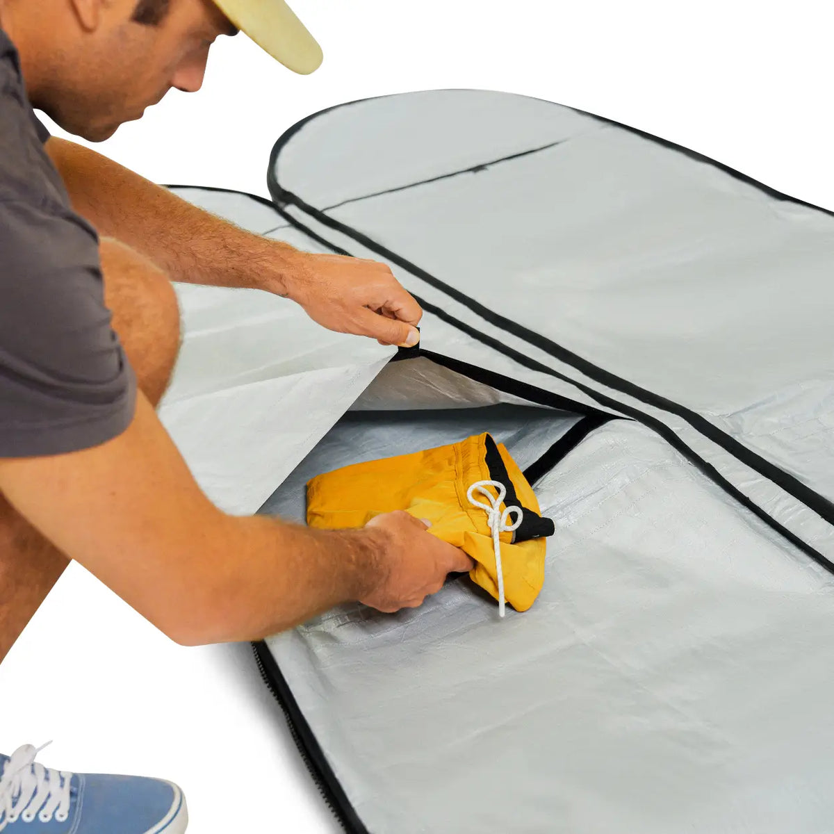 Surfboard bag with internal packing pockets. 